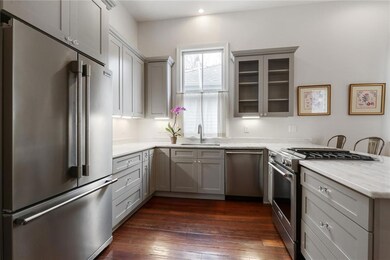 Chef's kitchen has stainless steel appliances, Qua