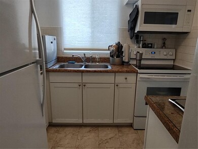 Dishwasher is on the countertop/left.