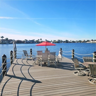 Dock area with a deck with water view