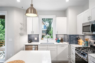 Beautiful Cabinets, Subway Tile and Neighborhood View