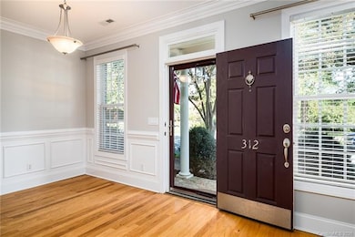 Wide foyer with large window greets guests. Lots o