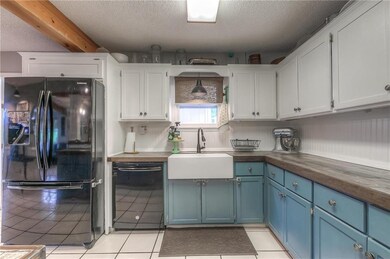 This darling country kitchen has cabinets and coun
