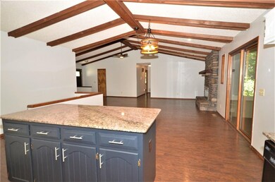 Looking from the kitchen across the dining area to the living room.
