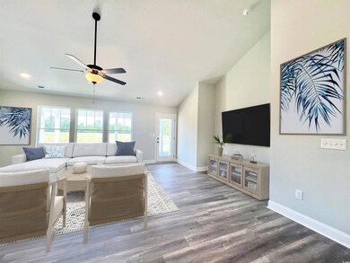 Living room with wood-laminate floors, ceiling fan