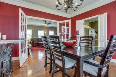 Dual access into Dining Room from Family Room and to Kitchen.  Privacy doors to Kitchen, French Doors to Family Room. 