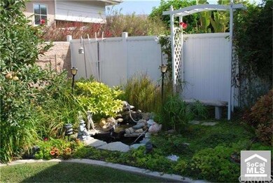 back side yard with fountain & pond