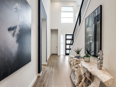 Entryway with hardwood / wood-style floors and a h