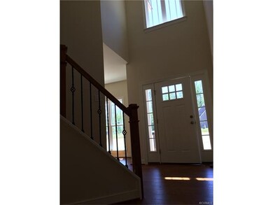 Foyer feels grand with cathedral ceilings