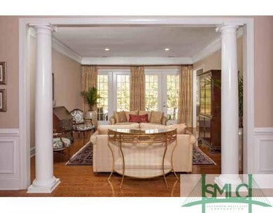 Living Room. Flanked by two pillars is this cozy L