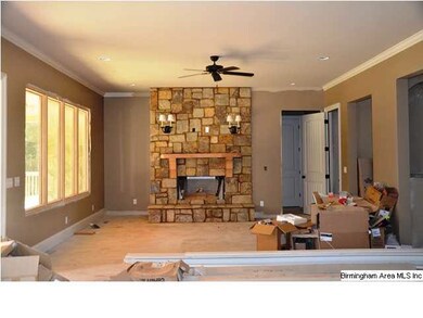 Great Room with tons of windows and beautiful ston