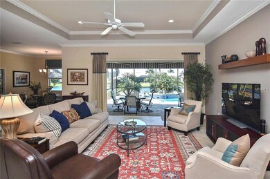 Living room with sliders to lanai and pool
