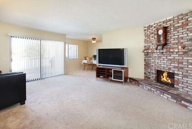 Spacious living room, cozy red brick fireplace, la