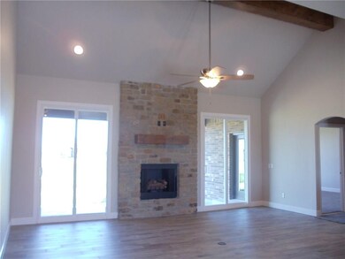 Spacious living room with vaulted ceiling.