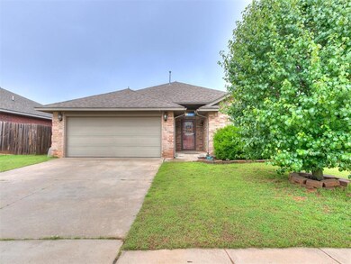 View of front facade featuring driveway, a garage, brick siding, and a shingled roof