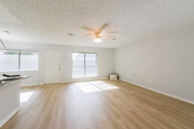 Spacious den is open to kitchen with breakfast bar.