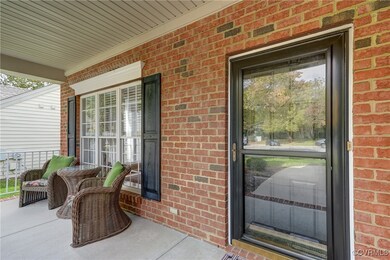 Handsome entryway with a solid storm door.