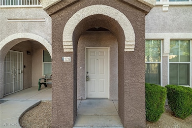 View of exterior entry with stucco siding