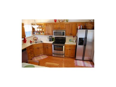 Ascend to the the eat-in kitchen featuring a vault