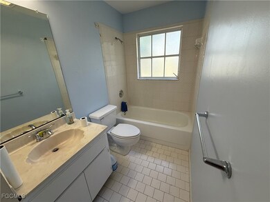 Full bathroom with tile patterned flooring, vanity