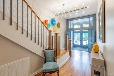 The reclaimed foyer light from Thalheimer's Department Store welcomes you into this unique home.