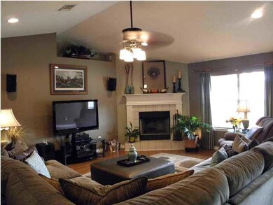 Open spacious living room with fireplace.