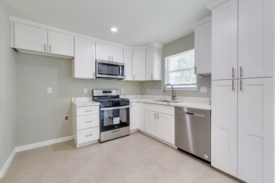 This kitchen area is complete with recessed lighti