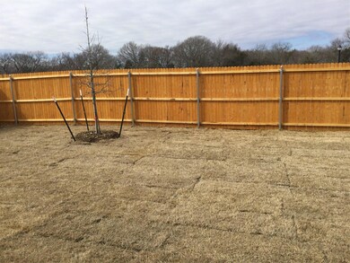 Yard with privacy fence.
