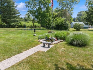 Paver Walkway Leading to Small Pond