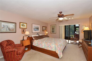 Large master bedroom with views of the water and a