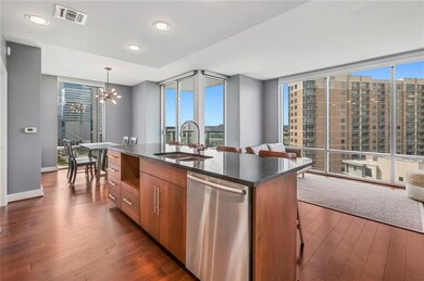 Kitchen featuring a sink, dishwasher, open floor 