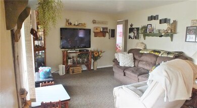 Living room with Newer wall to wall carpeting - ha