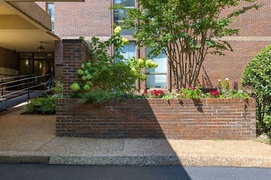 There are always beautiful flowers and plants in the beds around the highrise.