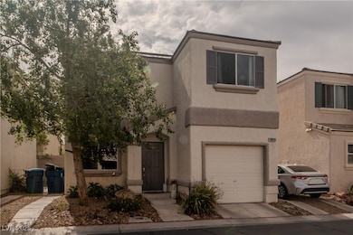 View of front of property featuring a garage and s