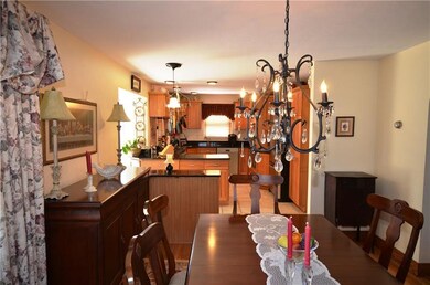 VIEW FROM THE DINING ROOM INTO THE KITCHEN.