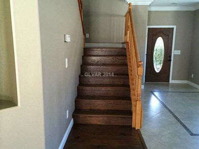 Property Photo. Wood staircase from dining room