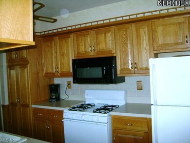 Kitchen with New gas stove and refrigerator