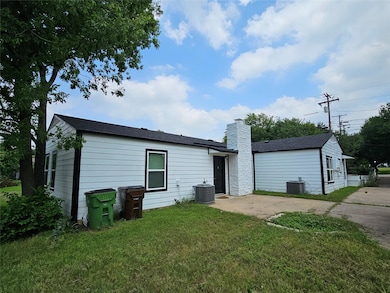 Rear view of property with a patio area, a lawn, and a chimney
