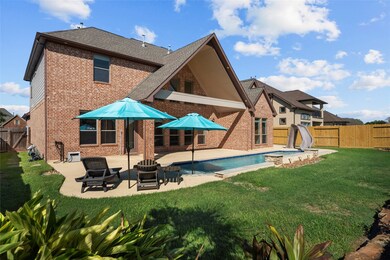 A beautiful backyard pool and landscaping! Gutters