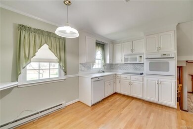Eat-in kitchen space with a view to family room access.