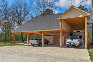 View of car parking featuring an attached carport,