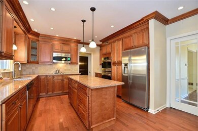 Kitchen angled so you can see the glass door leadi