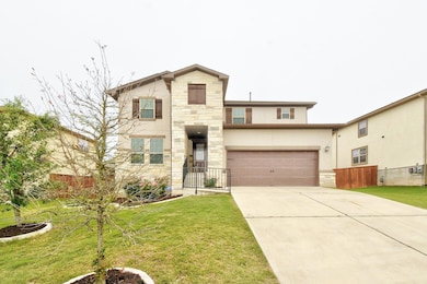 View of front of property with concrete driveway,