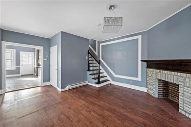 Freshly painted living space with elegant fireplac