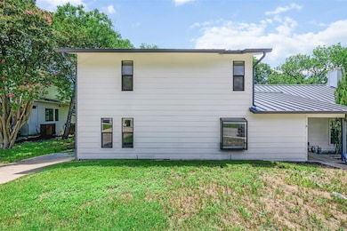 Rear view of property with a standing seam roof, 
