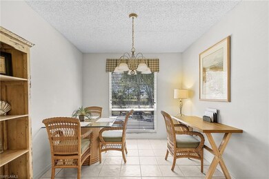 Dining space featuring an inviting chandelier, a t