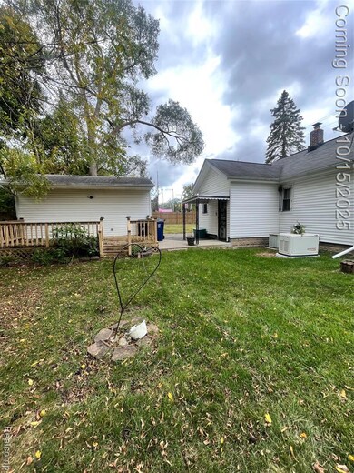 View of grassy yard with a patio