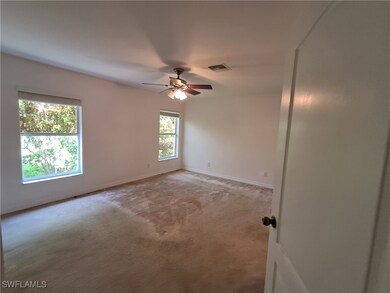 Spare room featuring ceiling fan and light colored