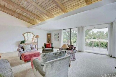 Large living room with high ceilings and floor-to-