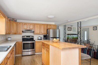 SPACIOUS KITCHEN WITH LOTS OF COUNTER & STORAGE SPACE. NOTICE THE STAINLESS STEEL APPLIANCES.