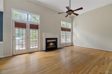 Unfurnished living room featuring light hardwood /